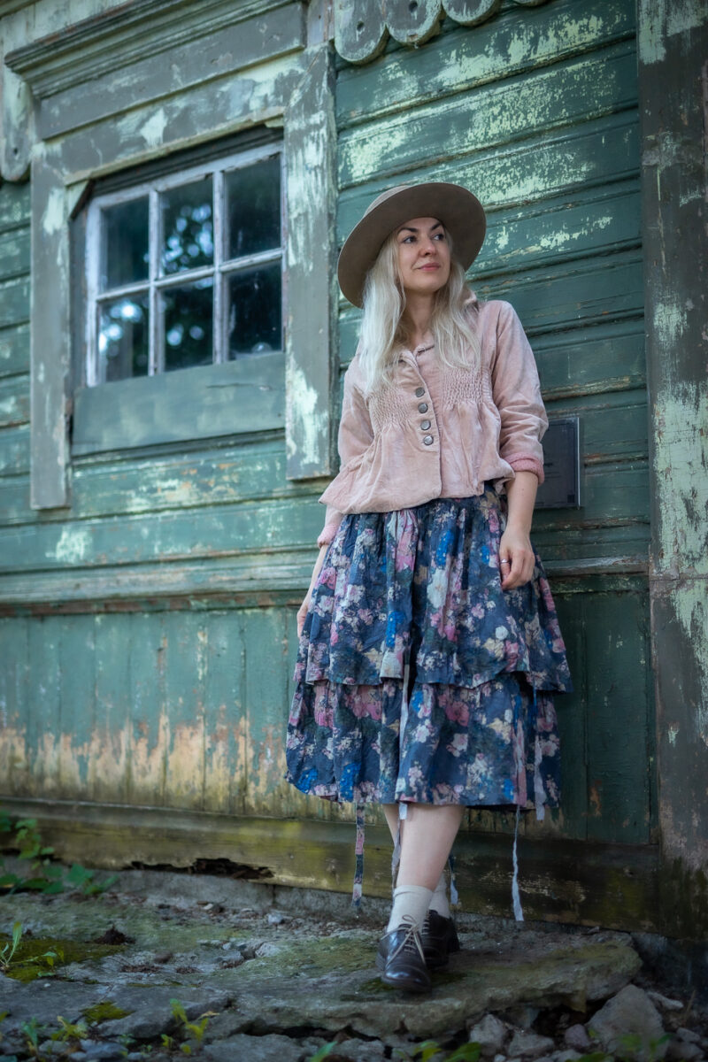 Lady with light pink velvet jacket and Ewa i Walla floral printed skirt